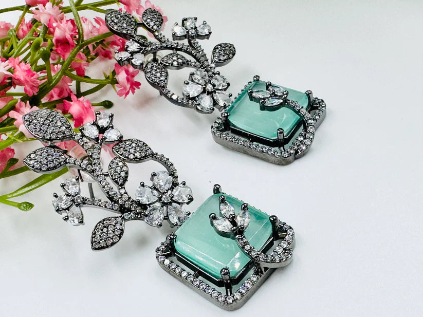 AESTHETIC GLASS STONE AND AD STUDDED EARRINGS